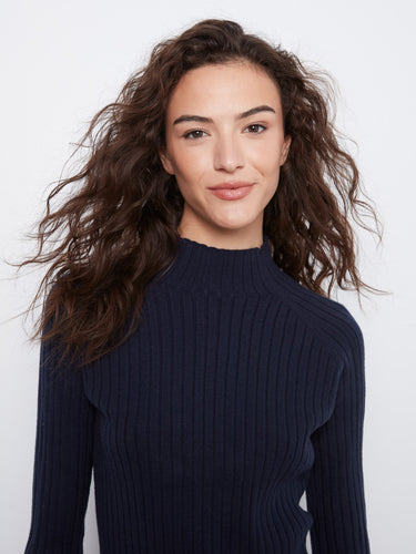 The mock neck of this navy sweater provides warmth and sophistication for any occasion. Fashioned by Charlie B.