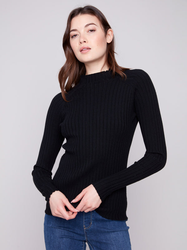 Black ribbed knit sweater featuring a stylish mock neck design by Charlie B.