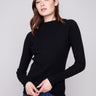 Black ribbed knit sweater featuring a stylish mock neck design by Charlie B.