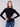 Trendy black ribbed knit sweater showcasing its elegant long sleeves by Charlie B.