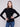 Trendy black ribbed knit sweater showcasing its elegant long sleeves by Charlie B.