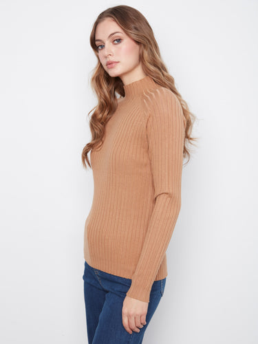 The slim fit of this sweater ensures a sleek silhouette while maintaining comfort. A timeless wardrobe staple by Charlie B.