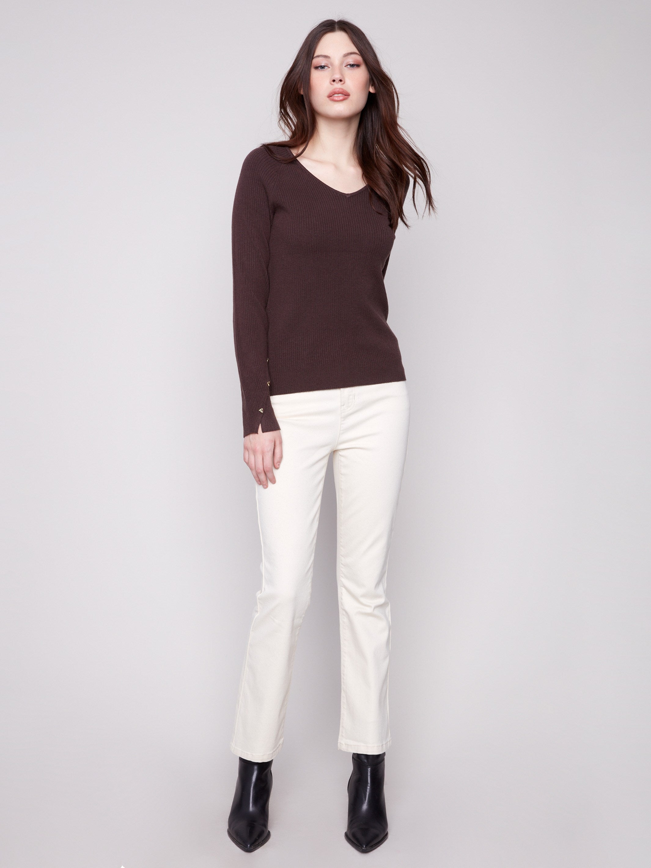Chic mocha V-neck sweater with slit cuffs, adorned with heart rivets for a unique touch by Charlie B.