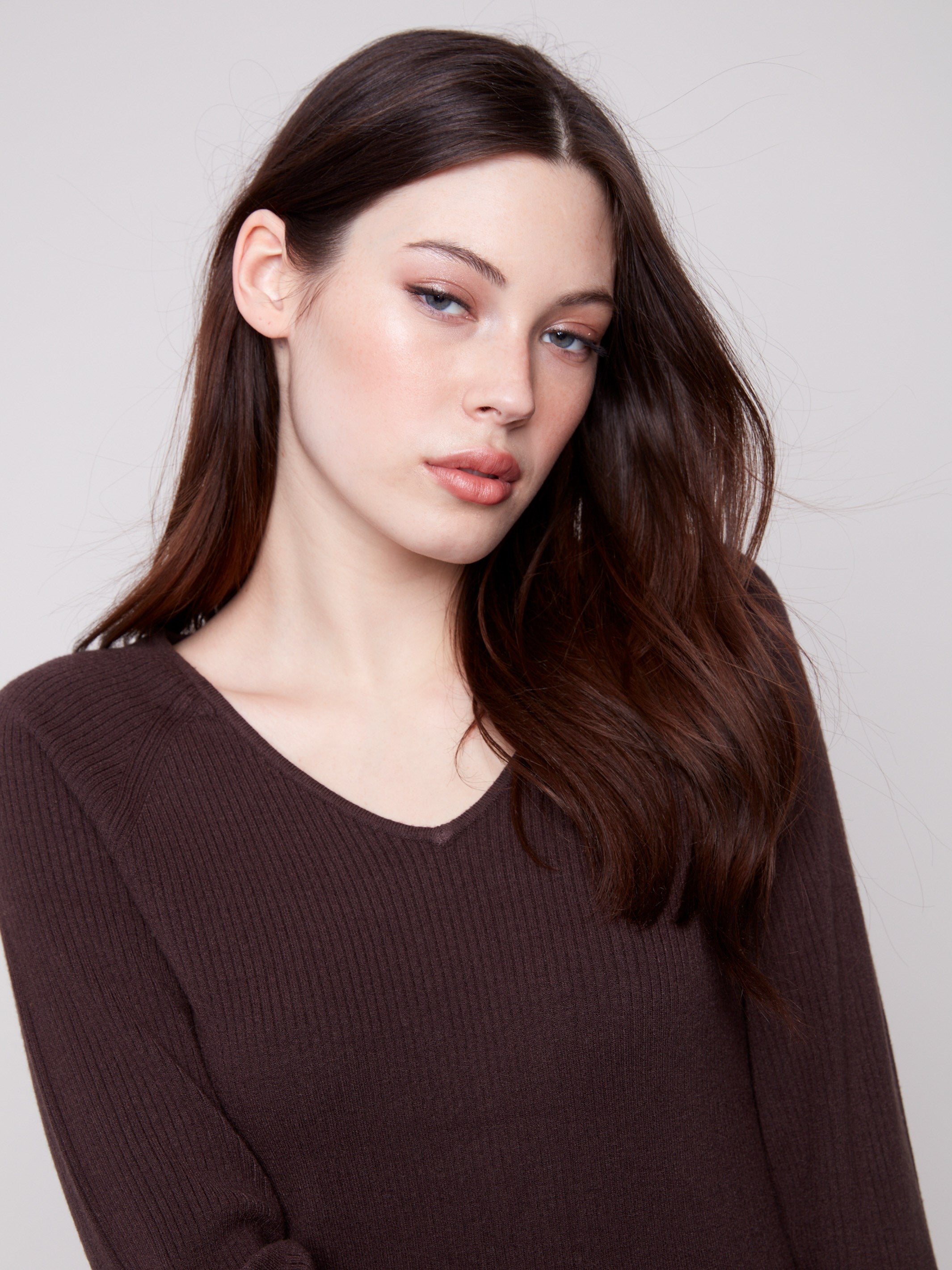 Elegant ribbed mocha sweater showcasing a flattering slim fit and charming heart rivets on the sleeves by Charlie B.