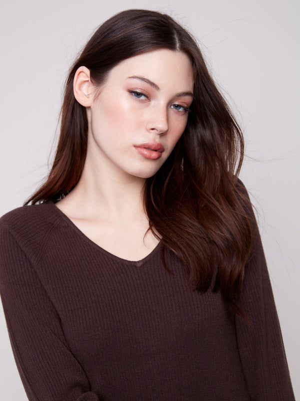 Elegant ribbed mocha sweater showcasing a flattering slim fit and charming heart rivets on the sleeves by Charlie B.