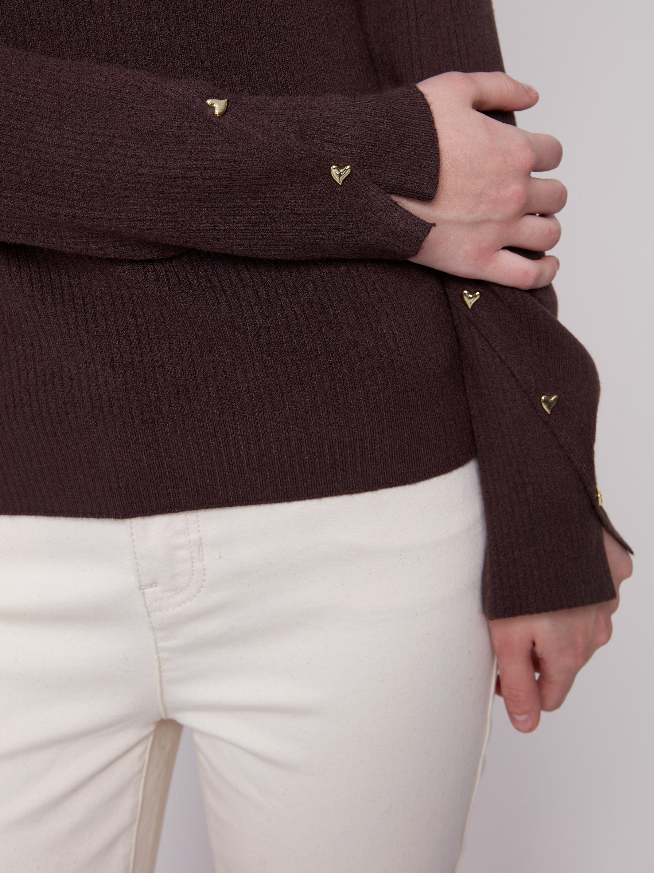 Stylish mocha V-neck sweater highlighting ribbed texture with distinctive slit cuffs and heart rivets by Charlie B.
