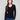 Black ribbed sweater featuring a slim fit design, perfect for a sleek silhouette by Charlie B.