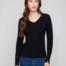 Black ribbed sweater featuring a slim fit design, perfect for a sleek silhouette by Charlie B.