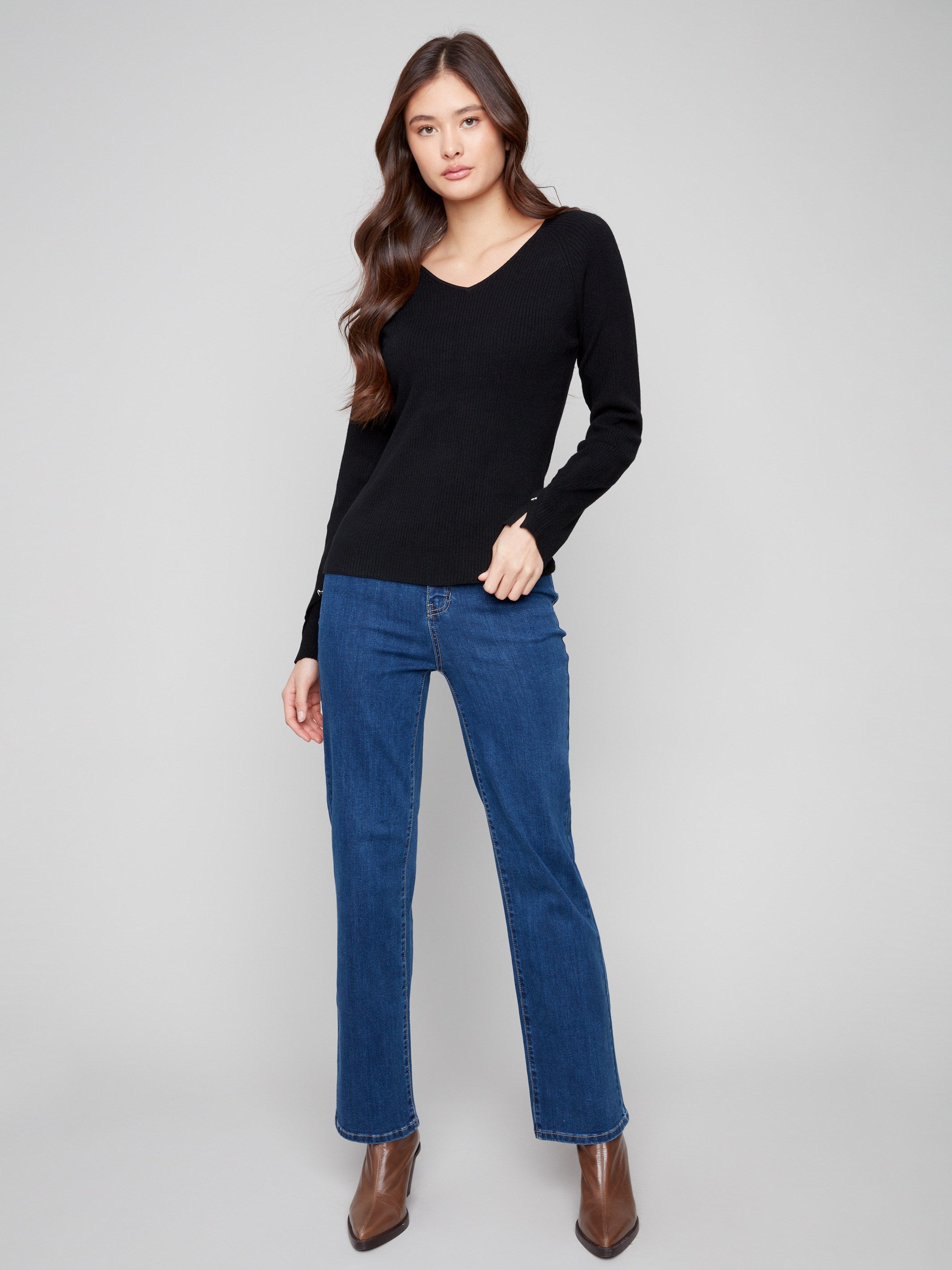 Elegant black sweater with stylish slit cuffs, adding a unique touch to your outfit by Charlie B.