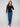 Stylish black sweater adorned with heart rivets on the sleeves for added detail by Charlie B.