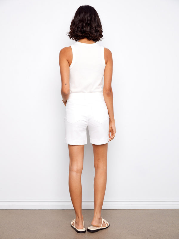 Designed in stretch twill fabric, these white shorts combine comfort with modern style effortlessly by Charlie B.