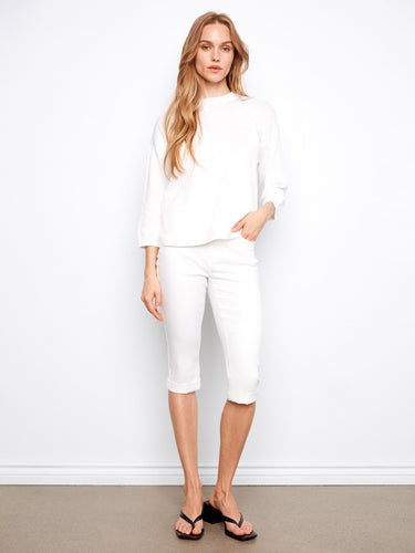 Elegant white sweater featuring a rounded hem and comfortable 3/4 sleeves by Charlie B.