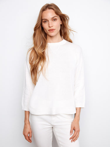 Chic white sweater crafted from 100% cotton, designed with a stylish crew neckline by Charlie B.