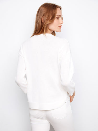 Classic white sweater showcasing a rounded hem and versatile design for any occasion by Charlie B.