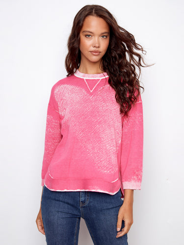 Stylish pink sweater made of 100% cotton with a rounded hem feature by Charlie B.