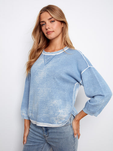 Showcasing a unique reversed print, this blue top is both eye-catching and comfortable. Enjoy the soft 100% cotton fabric by Charlie B.