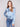 Stylish blue satin shirt with a unique twisted front detail and comfortable long sleeves by Charlie B.