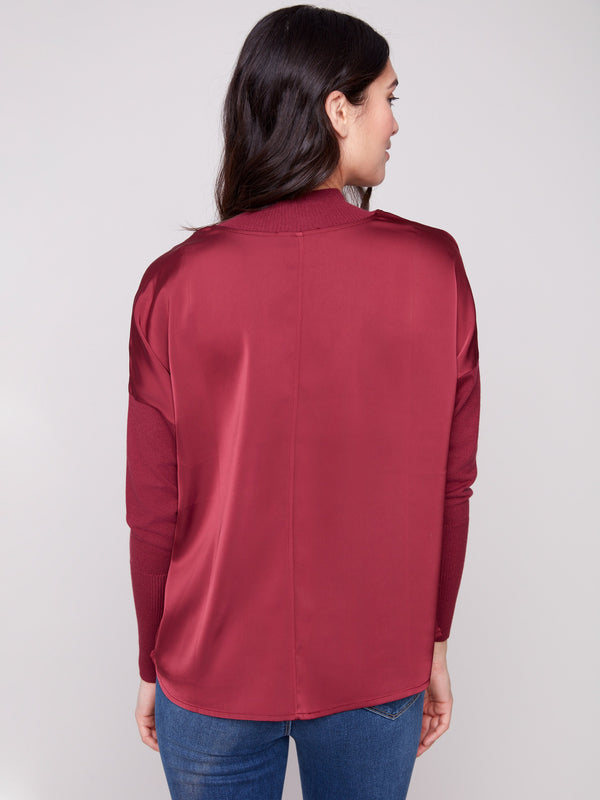 Elegant cabernet top featuring mock neck and seamless back design for a sleek appearance by Charlie B.
