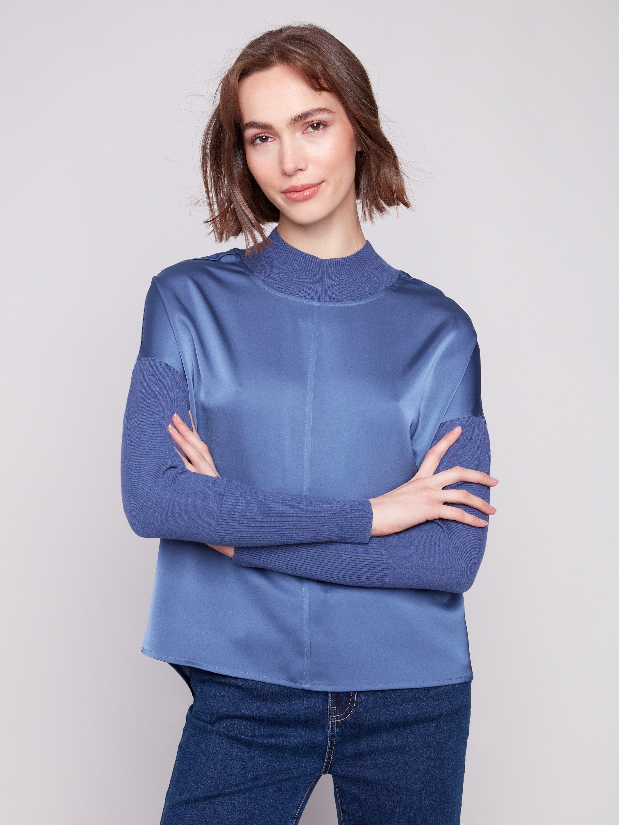 Elegant satin-knit top featuring ribbed cuffs and neckline, complete with a stylish front seam detail by Charlie B.