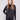 Elegant black satin-knit top with a chic mock neck and drop shoulders, perfect for any occasion by Charlie B.