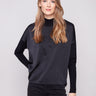 Elegant black satin-knit top with a chic mock neck and drop shoulders, perfect for any occasion by Charlie B.