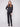 Stylish black top featuring a sleek front seam detail and ribbed cuffs for a modern look by Charlie B.