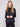 Chic black top showcasing drop shoulders and an elegant design that complements any style by Charlie B.