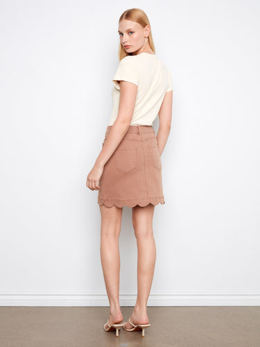Fashionable skirt with front pockets and back patch pockets for added functionality. By Charlie B.