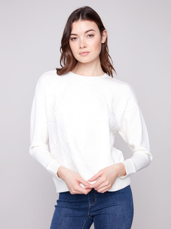 Elegant Ecru Scuba Knit Top with intricate soutache front detail, featuring a stylish crew neckline by Charlie B.