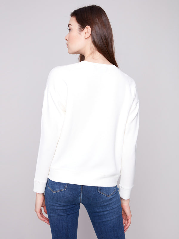 Sophisticated Ecru Scuba Knit Top featuring unique soutache front detail for a modern look by Charlie B.