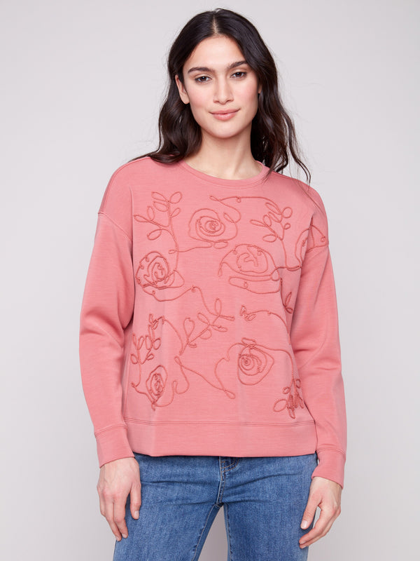 Primrose Scuba Knit Top with a classic crew neckline, perfect for casual elegance, featuring intricate design by Charlie B.