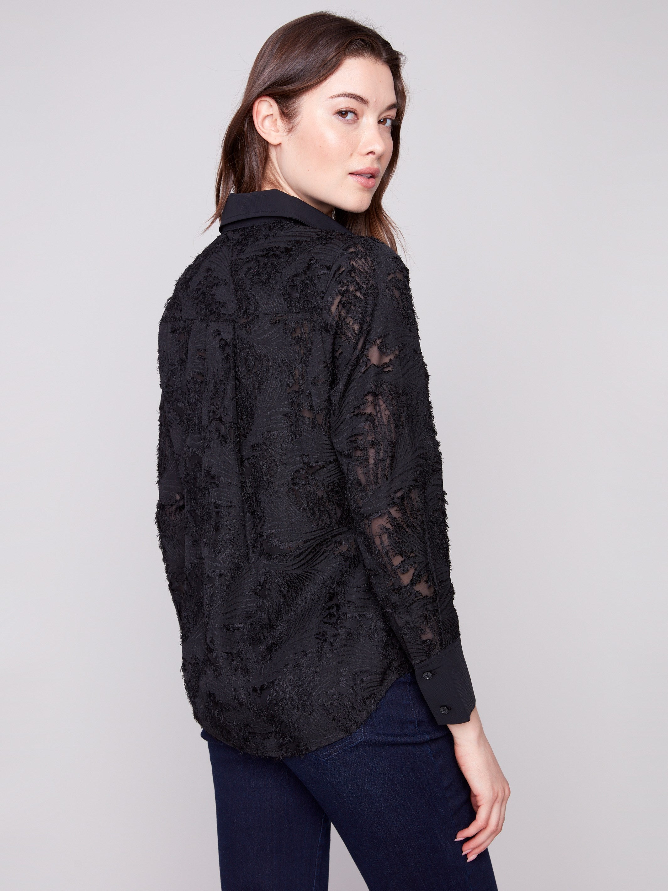 Stylish semi-sheer black chiffon top offering a unique abstract pattern design by Charlie B.