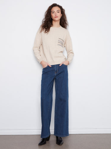 Elegant heather almond sweater with long sleeves and eye-catching sequin-striped pocket detail by Charlie B.