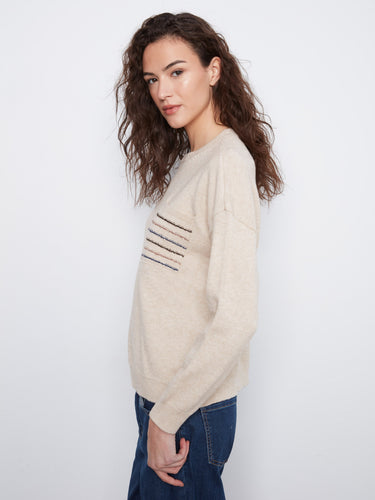 Chic heather almond sweater highlighting long sleeves and a sequin-striped pocket for added flair by Charlie B.