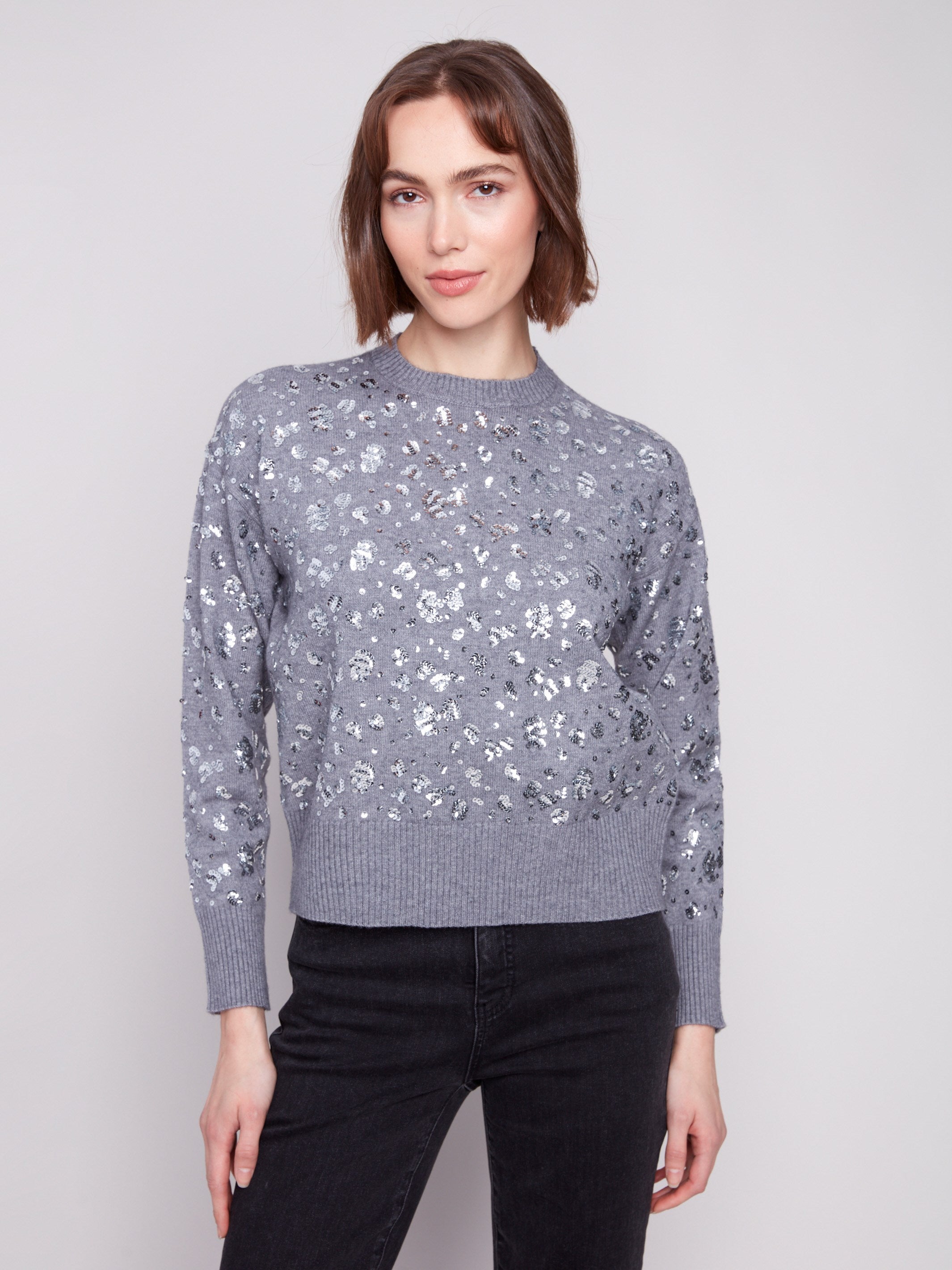 Heather grey sweater featuring a drop shoulder design with sparkling sequins by Charlie B.