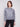 Heather grey sweater featuring a drop shoulder design with sparkling sequins by Charlie B.