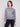 Elegant sweater in dark heather grey showcasing intricate sequins pattern by Charlie B.