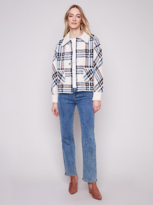 Ecru plaid knit jacket with a spread collar and button front closure, designed for stylish comfort by Charlie B.