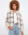 Cozy plaid jacket featuring a snap-button closure for easy wear, paired with casual jeans. Perfect for everyday style by Charlie B.