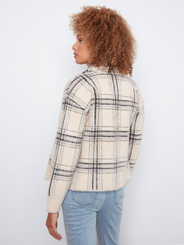 Plaid pattern adds a touch of sophistication to any outfit, combined here with light blue jeans for casual elegance by Charlie B.