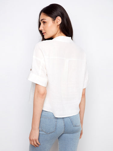 Casual white shirt showcasing practical chest pockets for added style and convenience, designed by Charlie B.