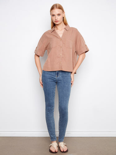 This chic top boasts a button-front design, perfect for effortless elegance in any casual setting by Charlie B.
