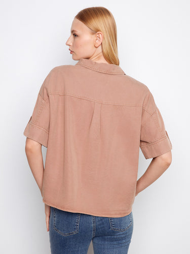 The shirt is designed with practical chest pockets, adding both style and functionality to your wardrobe by Charlie B.