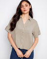 A stylish shirt with a classic collar, featuring short sleeves and button tabs for a versatile look. By Charlie B.
