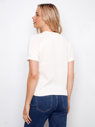 Crafted from pure cotton, the raglan sleeves provide ease of movement in this chic lemon-adorned top. By Charlie B.