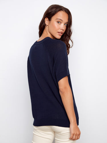 Trendy navy knitwear embellished with a charming strawberry design, featuring soft raglan sleeves in pure cotton. By Charlie B.
