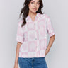 Button-down front pink and white blouse with shell print by Charlie B.