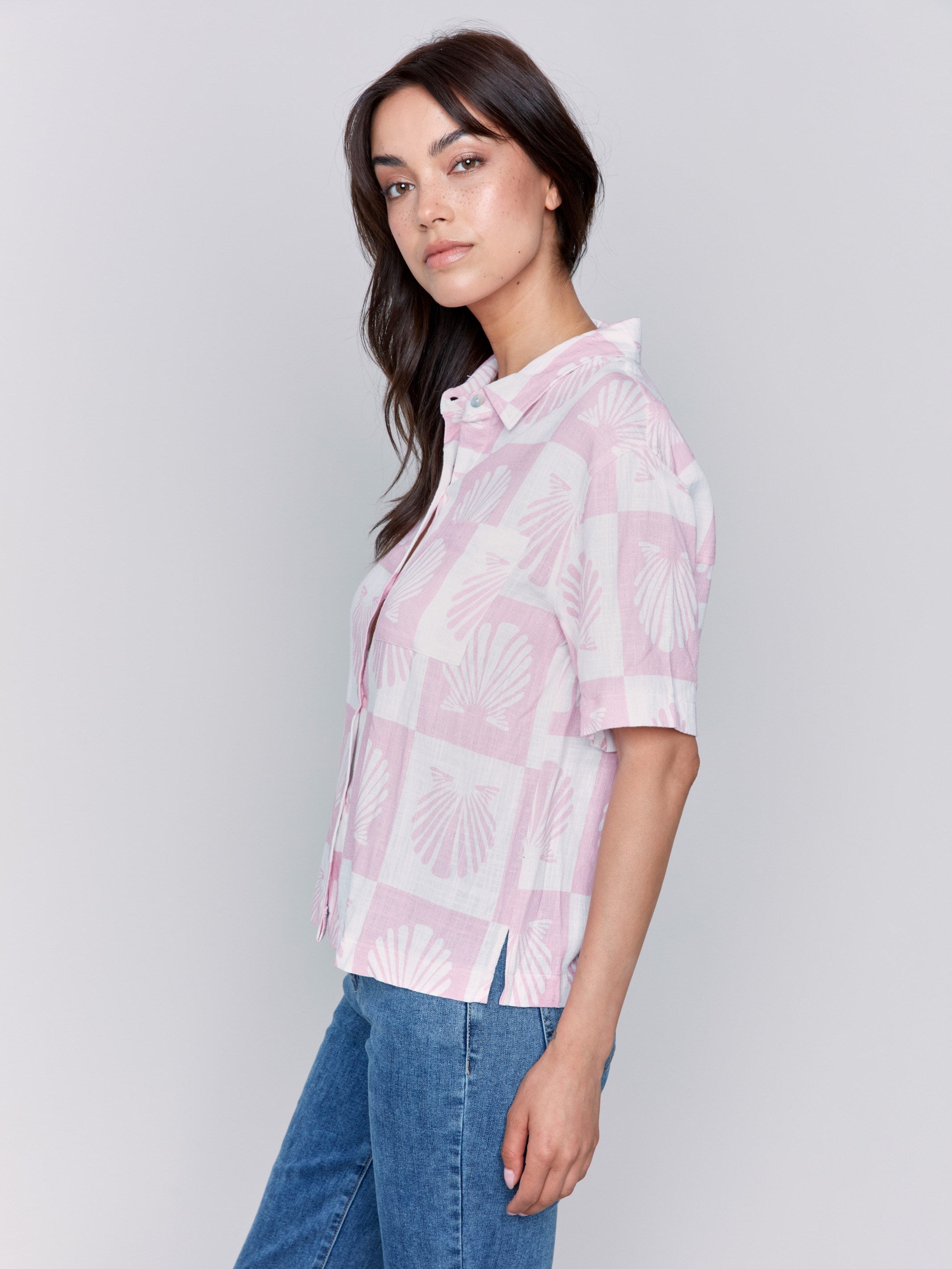 Short-sleeve pink and white blouse with a unique shell pattern by Charlie B.