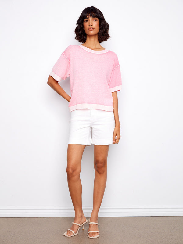 Featuring a unique reverse print, this pink top adds an artistic touch to your wardrobe. Perfect for casual outings by Charlie B.