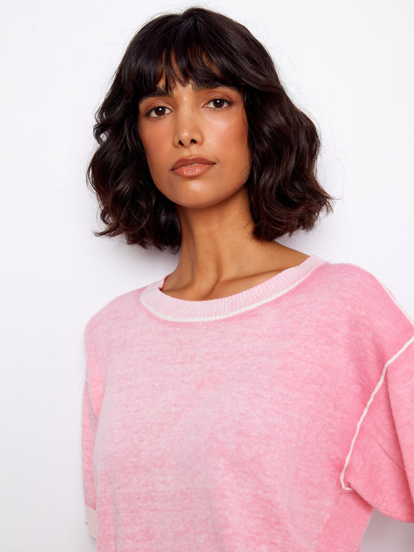 Designed with a relaxed fit, this pink top ensures ease and style throughout the day. Ideal for laid-back wear by Charlie B.